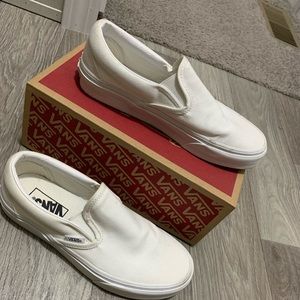 All white slip on Vans